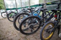 Rows of parked bicycles in a shelter, part of local transport infrastructure in Blackburn with Darwen