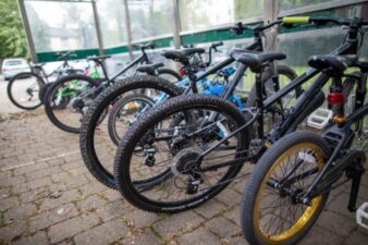 Rows of parked bicycles in a shelter, part of local transport infrastructure in Blackburn with Darwen
