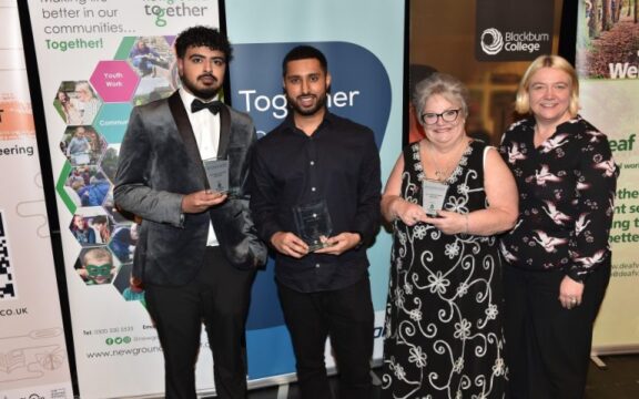 Community Volunteer Award winners from Blackburn with Darwen holding trophies at the 2024 celebration event