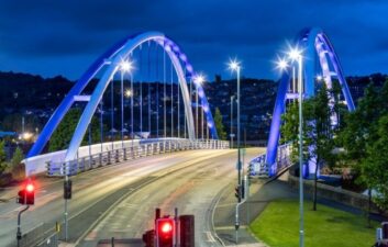 Wainwright Bridge lit up at night in Blackburn with quiet roads beneath, showcasing infrastructure improvements